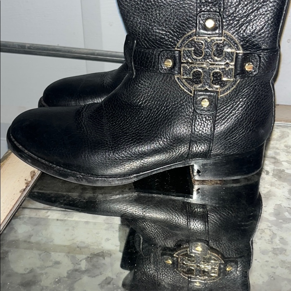 Black Tory Burch knee high boots.